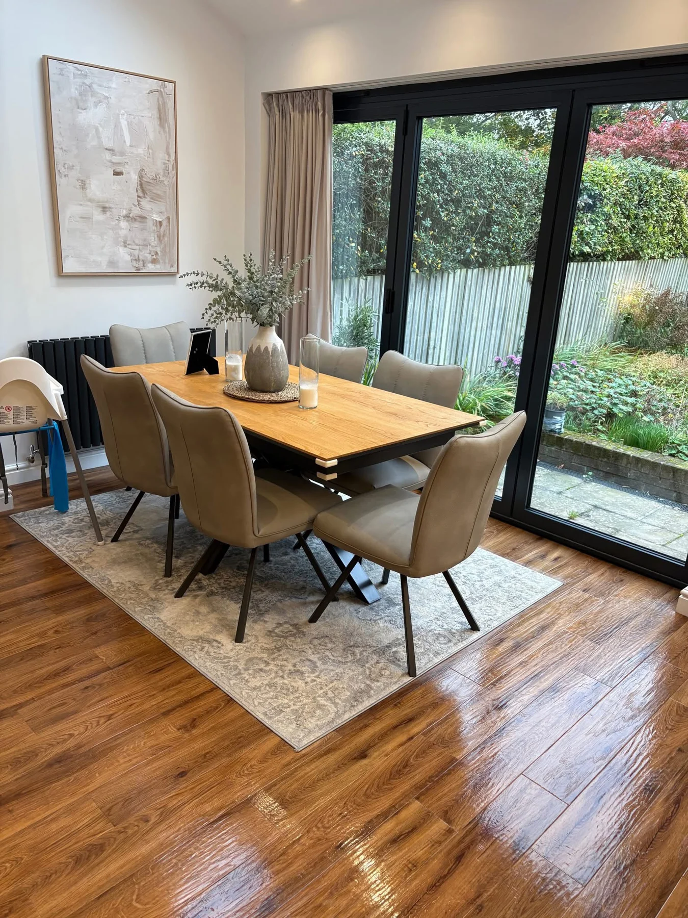 Dining room with a timber table and clean wood-effect floor